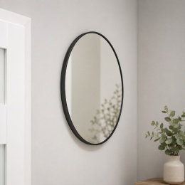 Okrągłe lustro ścienne 80 cm w czarnej ramie w nowoczesnej aranżacji wnętrza