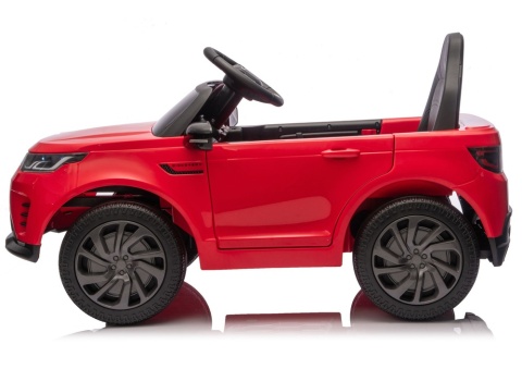 Czerwony Land Rover Discovery na akumulator – widok boczny