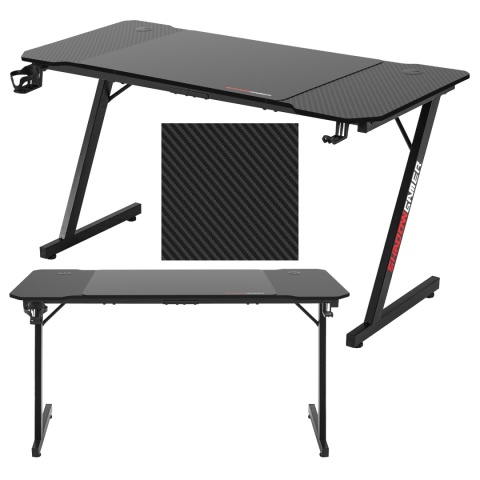 Czarne biurko gamingowe Shadow Gamer z blatem o strukturze carbon, metalowymi nogami i uchwytami na akcesoria.
